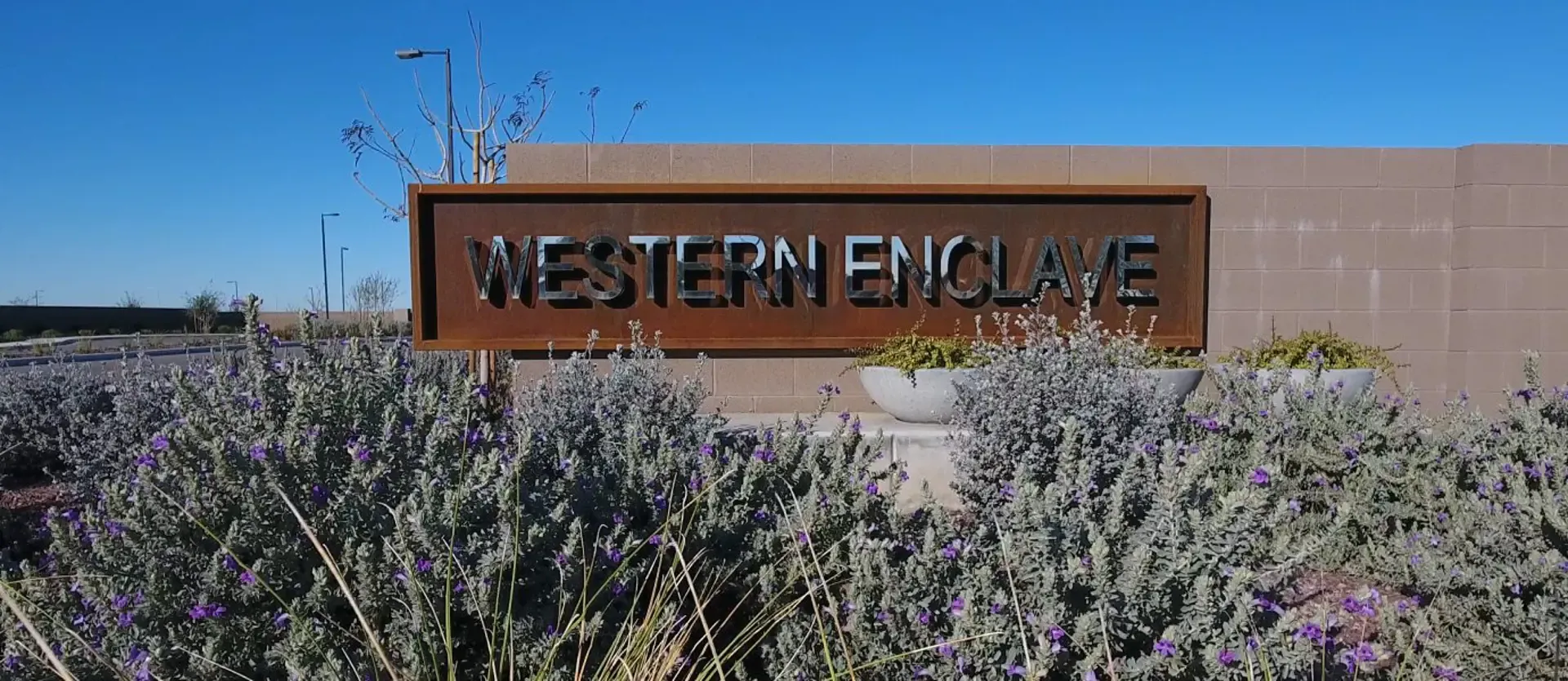 Western Enclave entry monument with blooming sage