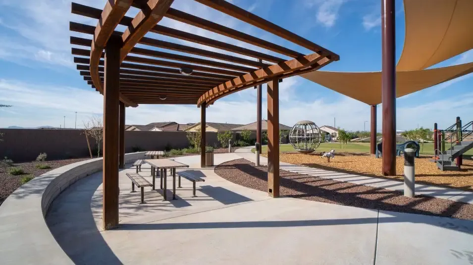 Shaded pergola seating in a Western Enclave park