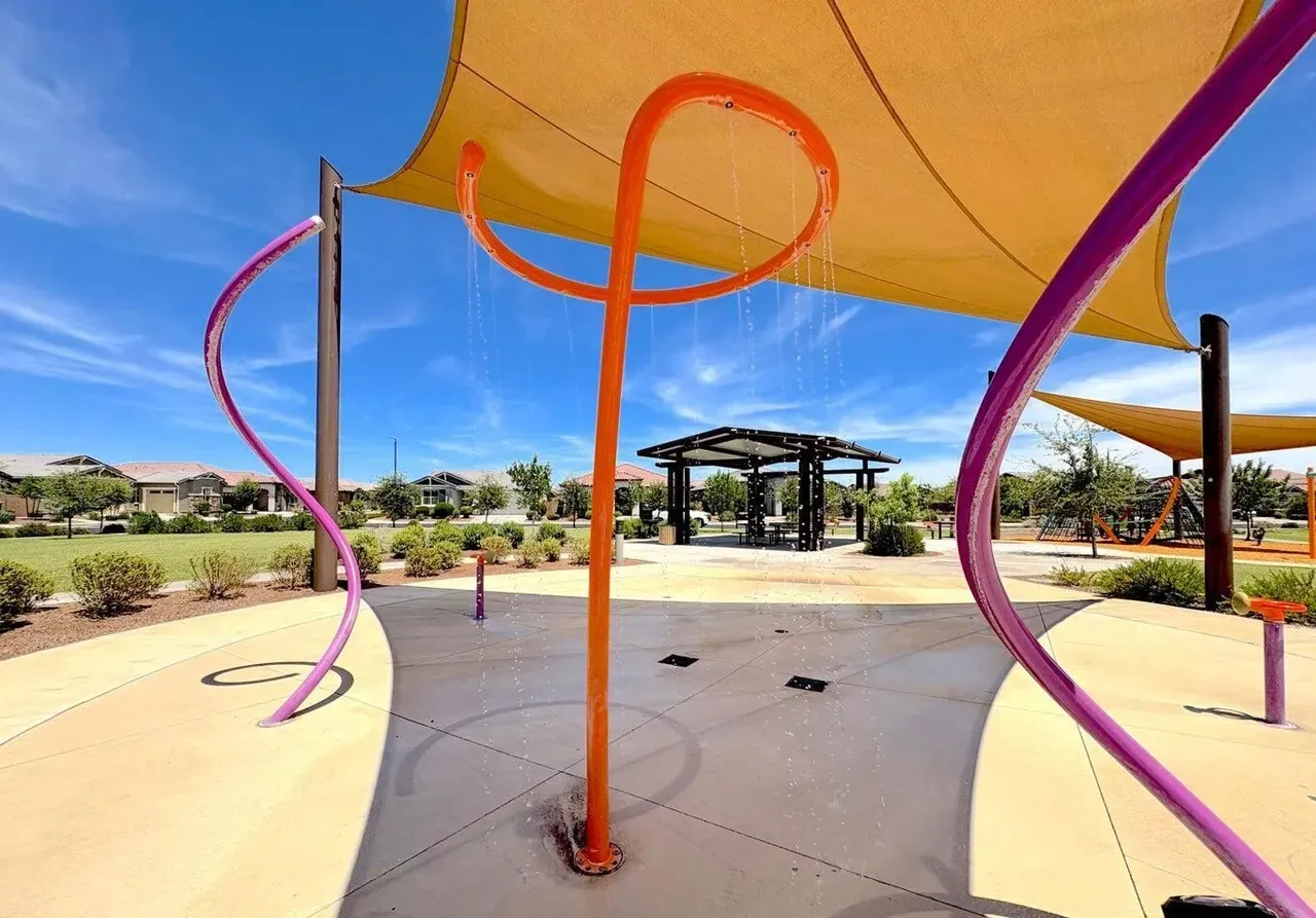Splash pad under shade sails